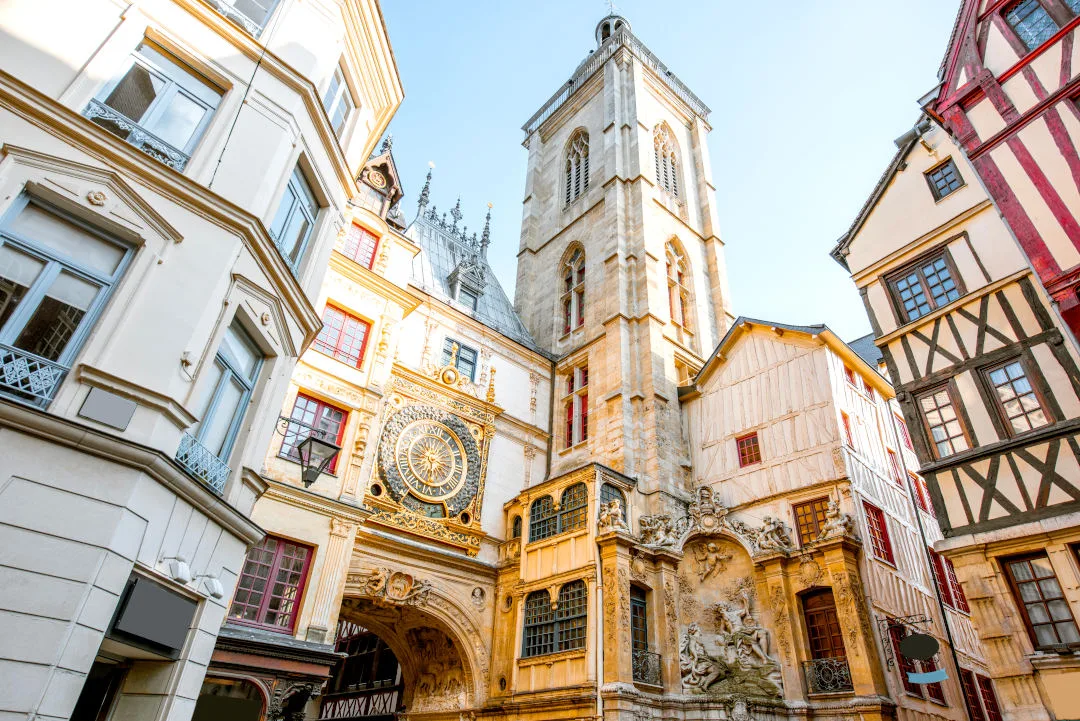 Street view with ancient buildings and Great clock on renaissance arch, famous astronomical clock in Rouen, the capital of Normandy region