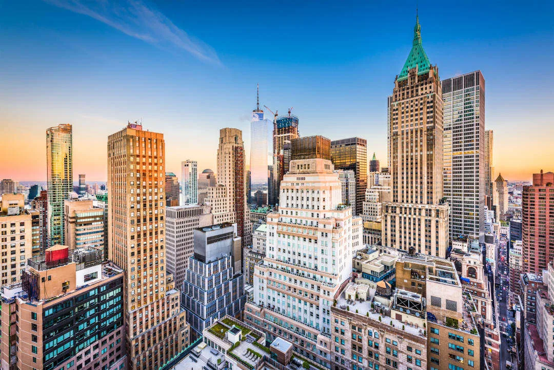 New York City Financial District cityscape at dusk.