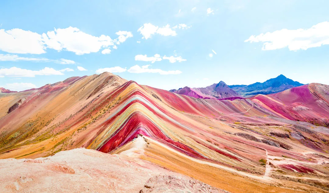 Panoramic view of Rainbow Mountain at Vinicunca mount in Peru – Travel and wanderlust concept exploring world nature wonders – Vivid multicolor filter with bright enhanced color tones